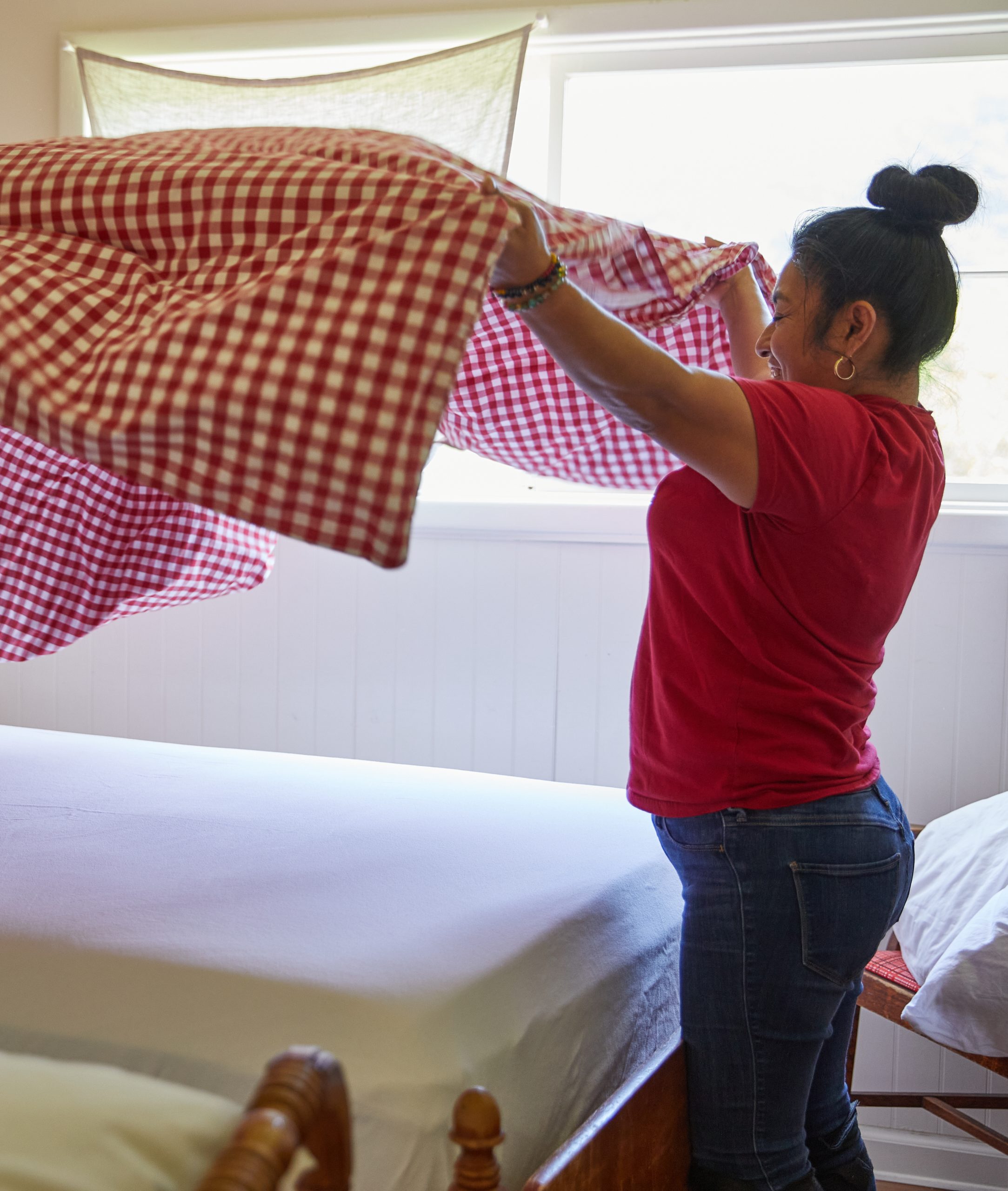 Karla, our head housekeeper making the bed