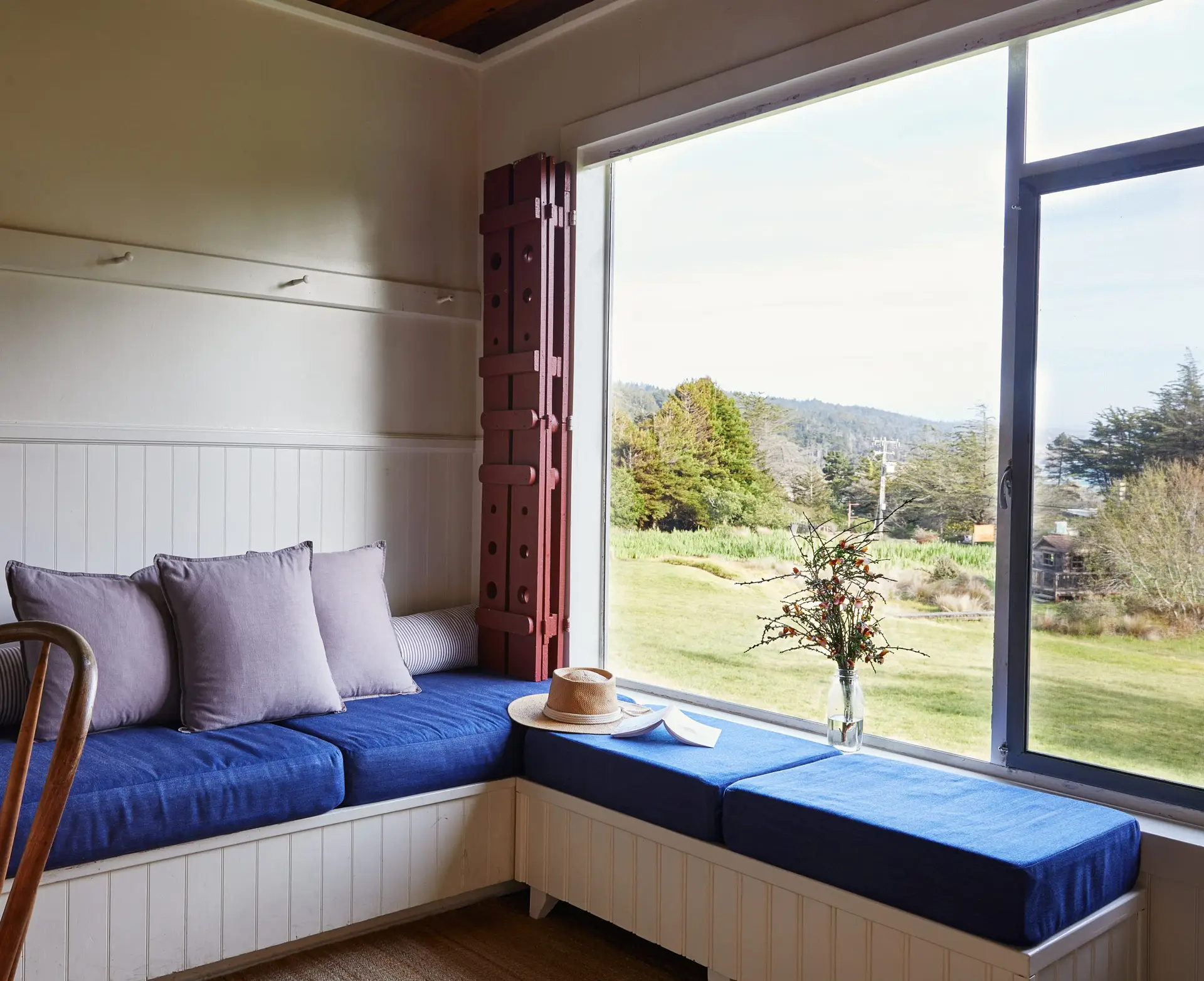 Bench seating in sitting area with big picture window