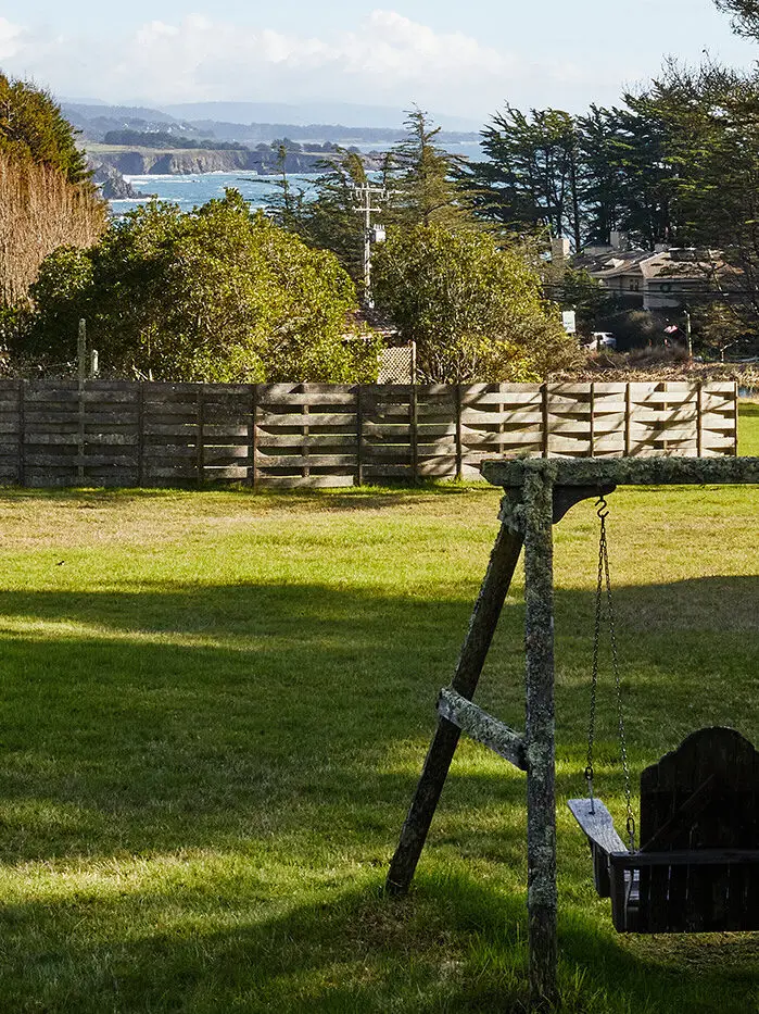 Two wooden swing seats overlook the Mendocino Coast